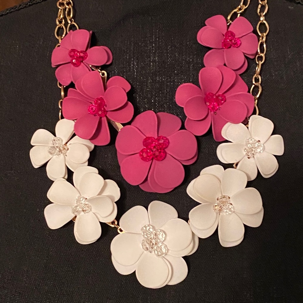 Two Floral gold tone Necklaces: fuchsia and white